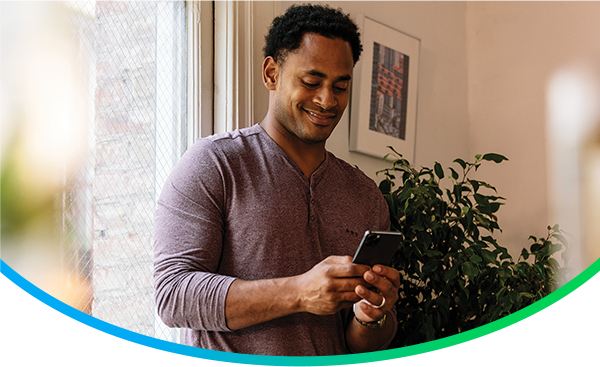 Image of happy customer using wifi on their phone